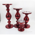 red colored large glass candlestick holder